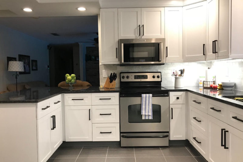 Black handles on white cabinets