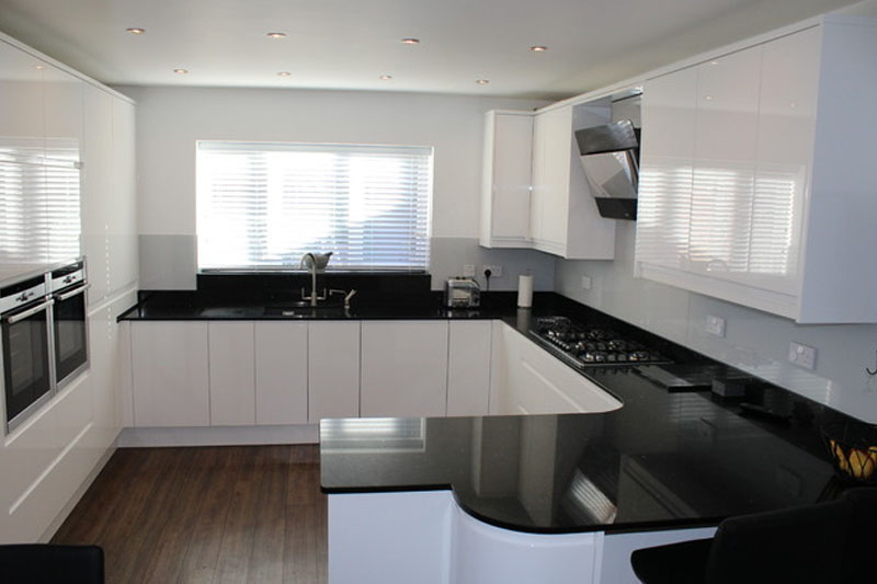 Glossy white and dark marble kitchen design