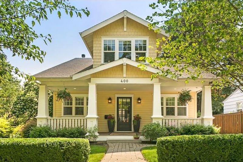 Hunter green door with yellow home