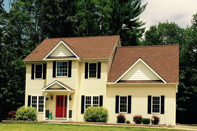Red front door yellow home
