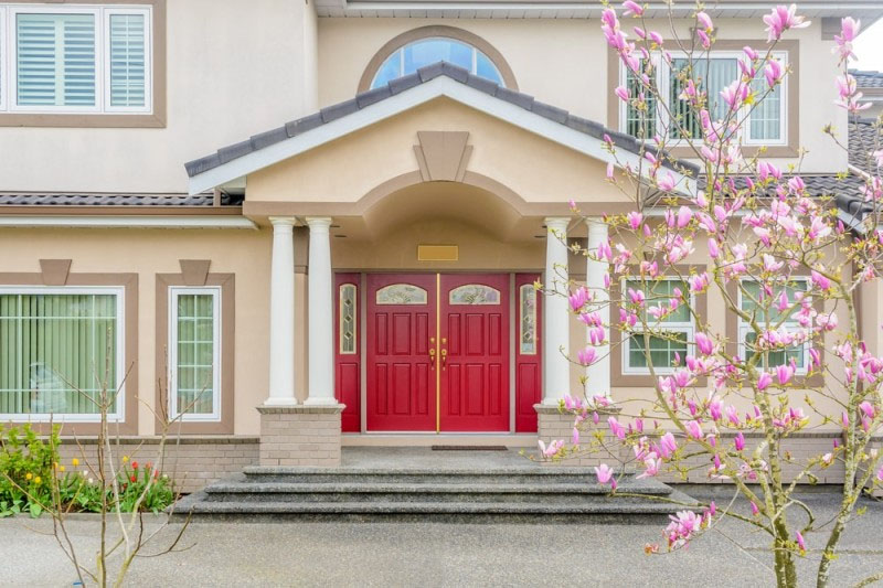 red front door beige house